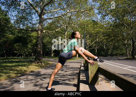 Female jogger stretching Stock Photo