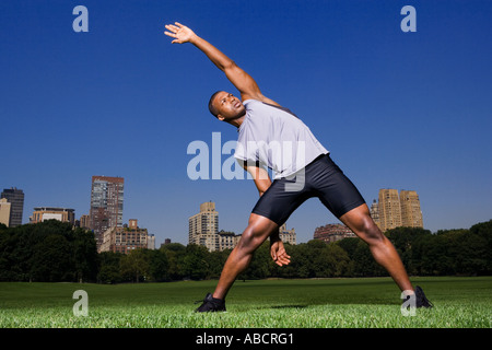 Man stretching in the park Stock Photo