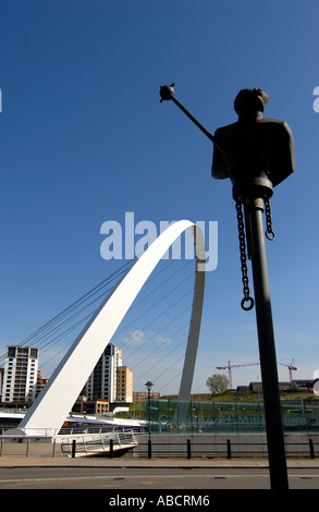 People walk Gateshead Millennium Bridge, Newcastle on Tyne, England ...