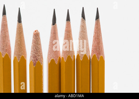 Broken pencil amongst sharp pencils Stock Photo