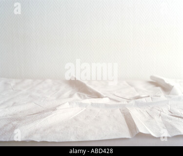 Crumpled sheets on hospital bed Stock Photo