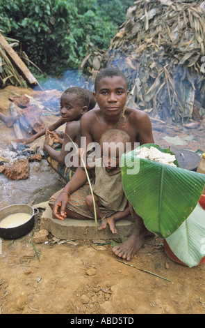 A pygmy camp in the rainforest with typical leaf shelters, Republic of Congo Stock Photo