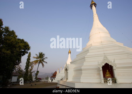 White chedis at hill top temple Wat Phra That Doi Kong Mu Mae Hong Son north Thailand Stock Photo