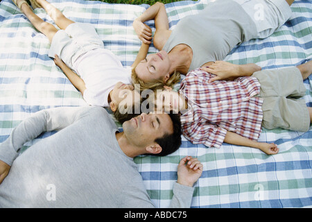 Family lying down sleeping Stock Photo