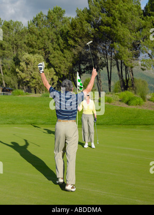 Couple playing golf Stock Photo