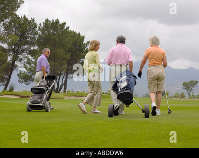 Golfers walking Stock Photo