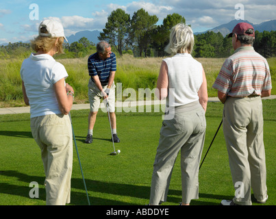 Friends playing golf Stock Photo