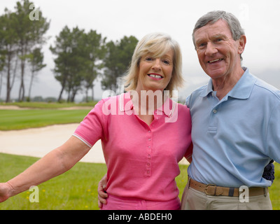 Couple on golf course Stock Photo
