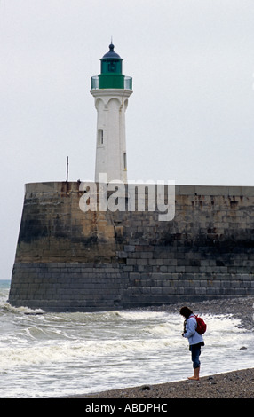 France, Normandy lighthouse woman standing on sea coast Stock Photo