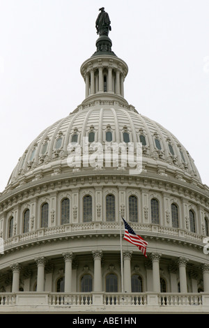 Close Up of the Front View of the United States Capitol Building with the  American Flag oUSA Flying in the Breeze Stock Photo