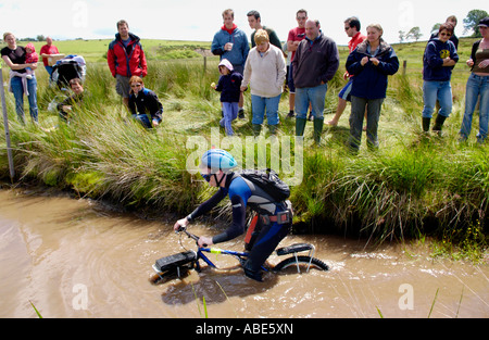 Competitor in the annual World Mountain Bike Bog Snorkelling Championships at Llanwrtyd Wells Powys UK Stock Photo