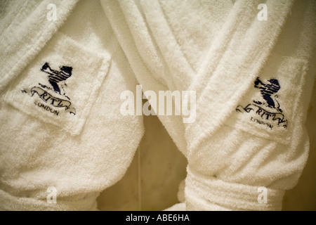 Monogrammed bath robes hang in a room at the Ritz Hotel in London Stock Photo