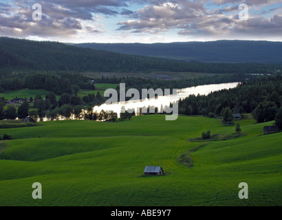 peacful mood in the evening in the mountains of Jamtland Jämtland Jaemtland near by Åre Are with green hilly meadows and the lak Stock Photo