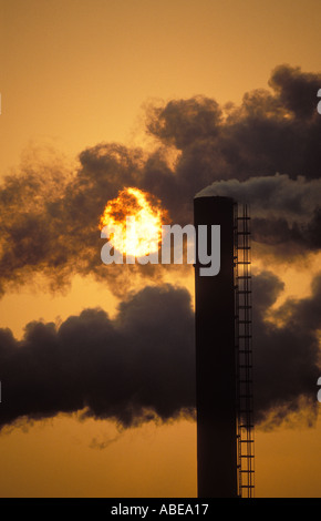 Belching smokestacks Pollution at sunset Avonmouth Avon England UK Stock Photo