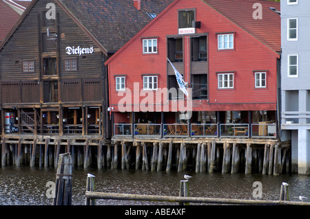 Trondheim old wooden timber warehouses wharves on stakes at the river Nid Nidelva Stock Photo