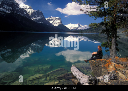 Person overlooking St Mary Lake at Waterton Glacier International Peace Park / Montana Stock Photo