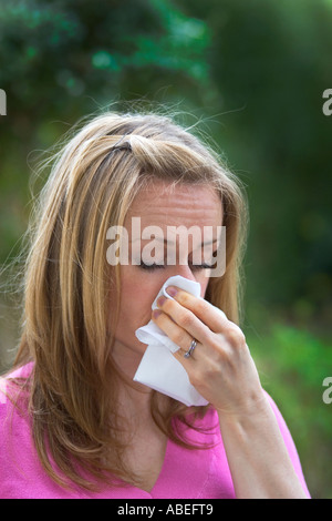 A young lady suffering from hay fever Stock Photo