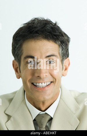 Man looking at camera with toothy smile, head and shoulders, portrait Stock Photo
