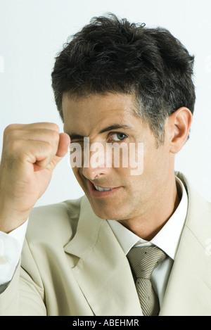 Man winking and making fist, head and shoulders, portrait Stock Photo