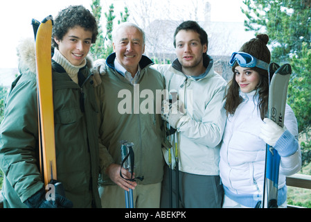 Senior man with grandchildren in ski clothing, portrait Stock Photo