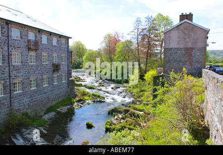 Former flannel mill converted to apartments on the banks of the River Severn at Llanidloes Powys Mid Wales UK Stock Photo