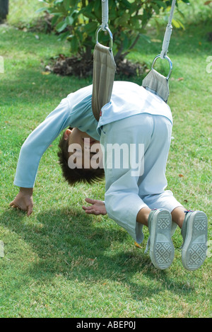 Hanging upside down. Kids are having fun on the playground Stock Photo ...