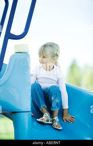 Child on playground equipment Stock Photo