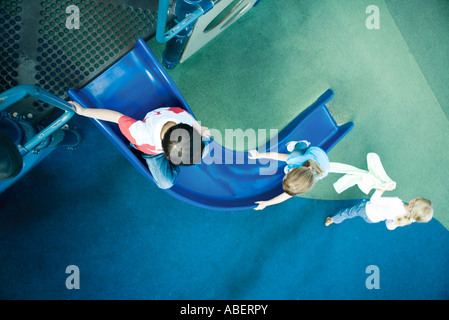 Children on playground equipment Stock Photo