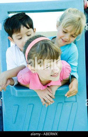 Children on playground equipment Stock Photo