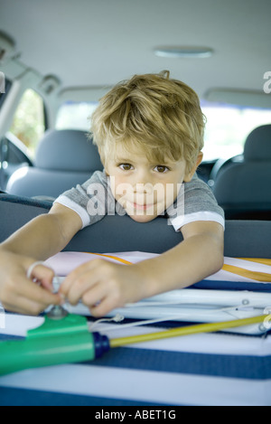 Boy in back of car Stock Photo