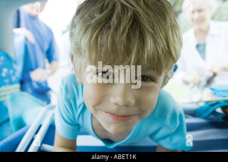 Boy in car, looking at camera Stock Photo