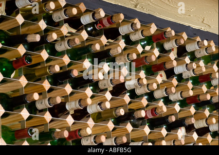 racks of wine lined up in a restaurant to store the wine ready for drinking Stock Photo