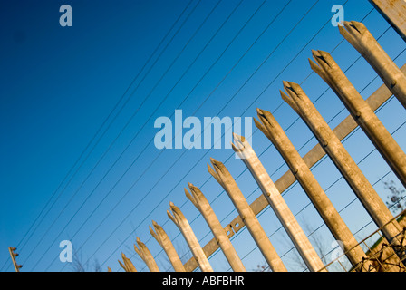 security fencing around business premises to keep thieves out These are abstract views of the precautions businesses Stock Photo