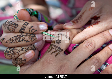 Applying decorative henna Stock Photo