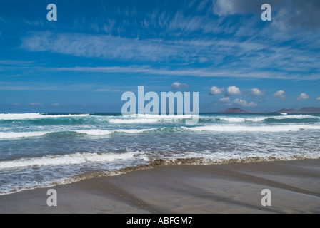 dh Playa de Famara FAMARA LANZAROTE Surf waves breaking on sandy beach sea Stock Photo
