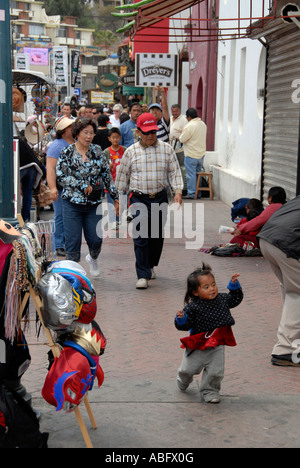 Ensenada street vendors and child running. Baja Mexico Stock Photo