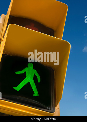 A traffic light illuminated green with a pedestrian crossing symbol ...