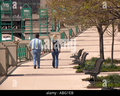 Young couple walking along Riverwalk Chicago Illinois USA Stock Photo