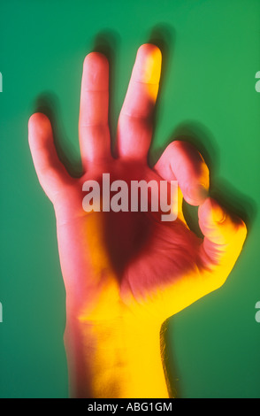 BUSINESSMAN S HAND IN OKAY GESTURE SIGN Stock Photo
