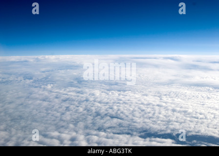 typical views you see when flying above the clouds in a aeroplane maybe on holiday or going on a business trip Stock Photo
