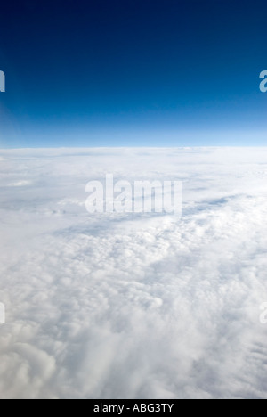 typical views you see when flying above the clouds in a airplane maybe on holiday or going on a business trip Stock Photo