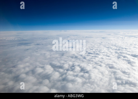 typical views you see when flying above the clouds in a airplane maybe on holiday or going on a business trip Stock Photo