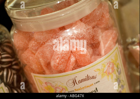some sweets in a jar in a shop window Stock Photo