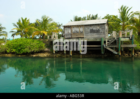 Old wooden shack on stilts by waterfront at Stuart Cove s Diving Nassau Bahamas Stock Photo