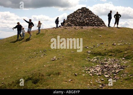 A family and other walkers admire the views and take the fresh air from the top of Dunkery Beacon on Exmoor, Devon. England Stock Photo
