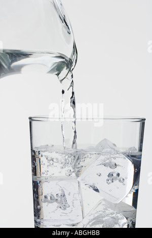 Pouring a glass of ice water Stock Photo