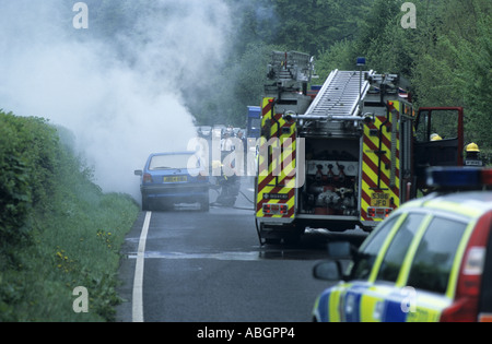 Car fire attended by emergency services on A40 road, Powys, Wales, UK Stock Photo