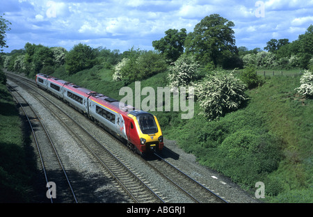 Virgin Voyager diesel train at Hatton Bank, Warwickshire, England, UK Stock Photo