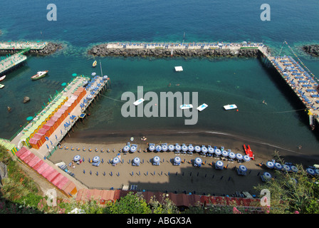 Sorrento coastal resort aerial view looking down on highly organised waterside beach sunbathing facilities early arrivals enjoying the sunshine Stock Photo