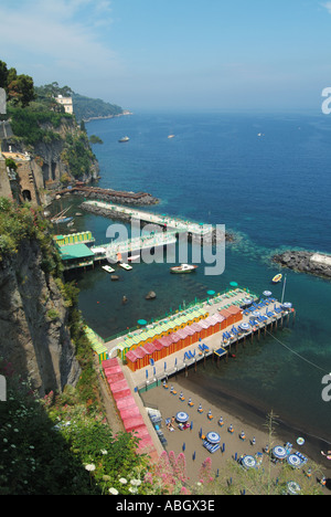 Sorrento coastal resort aerial view looking down on waterside beach sunbathing facilities early arrivals enjoying Stock Photo